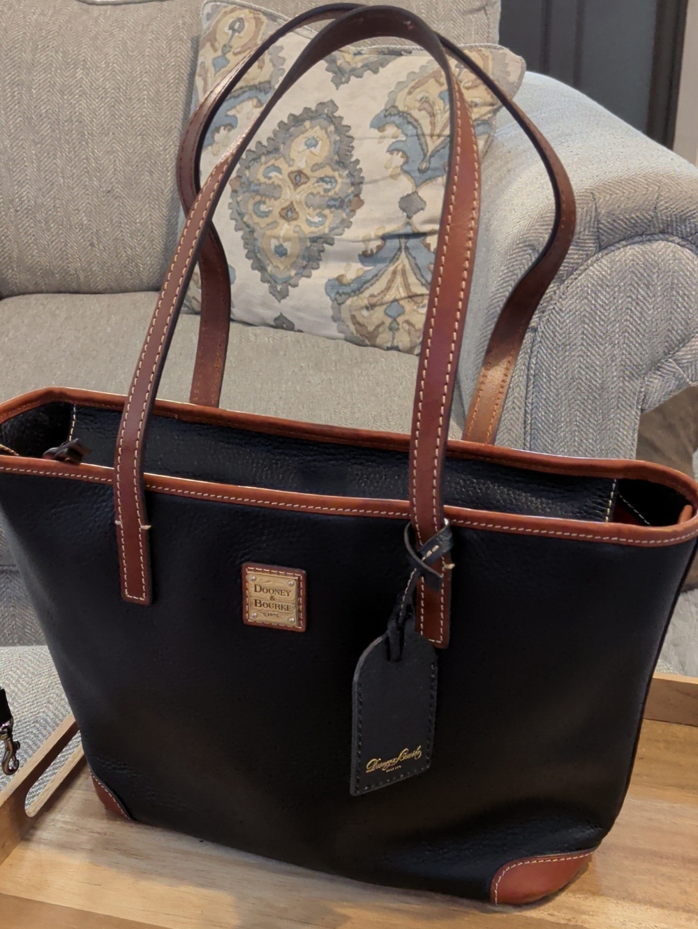 Dooney & Bourke Black Pebble Leather Tote with Brown Trim and Handles